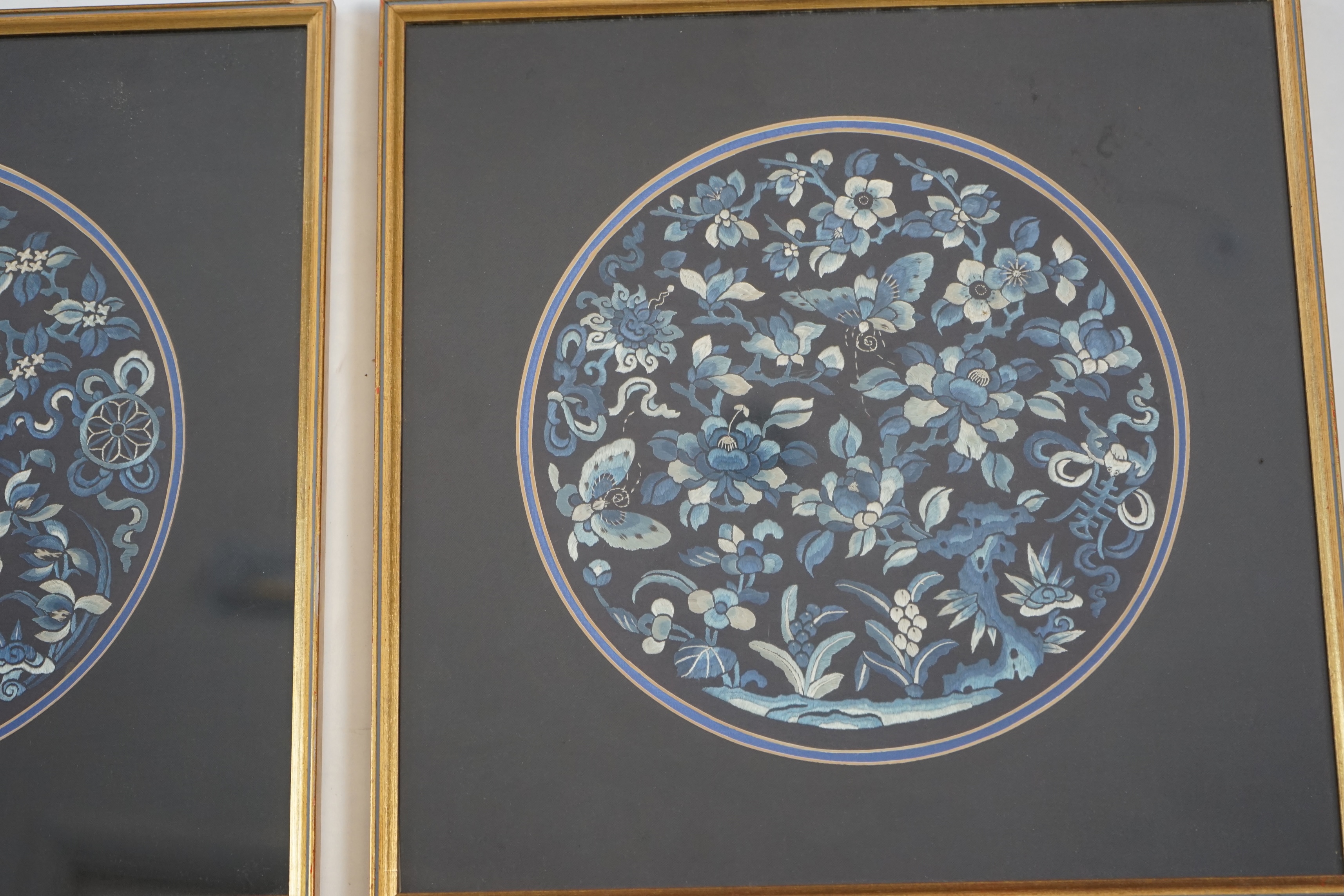 A pair of Chinese embroidered silk roundels, mid 19th century